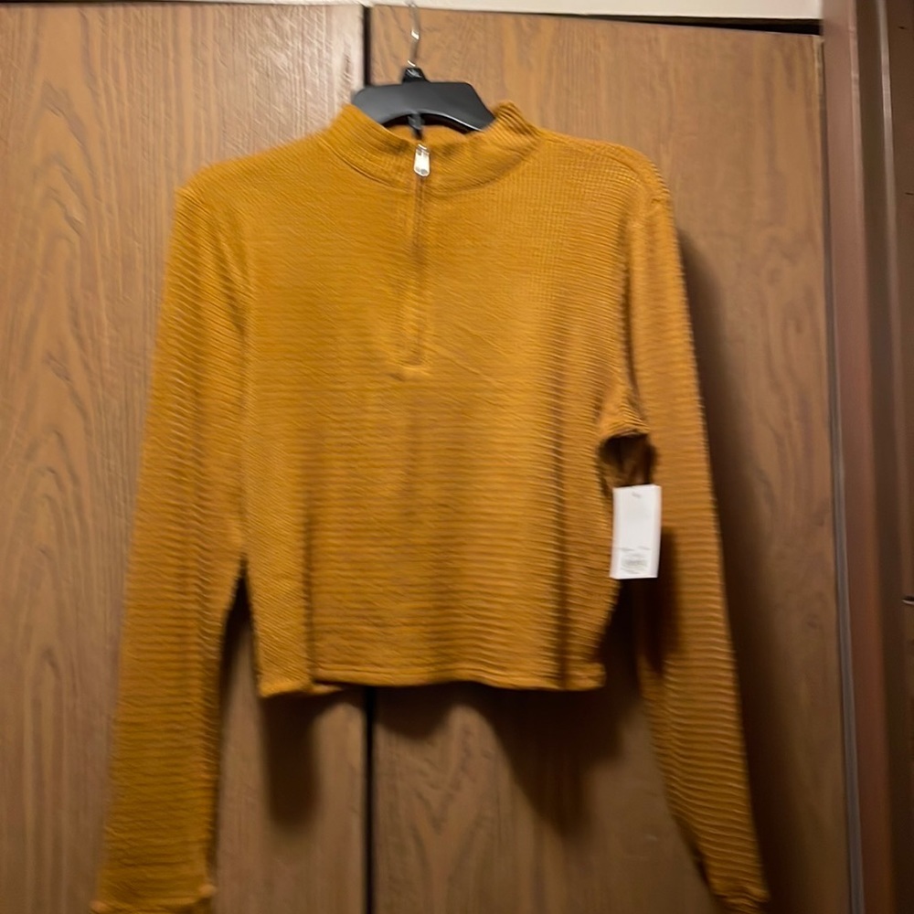 🔥Sale🔥..golden colored with a zipper from chest to neck..NWT